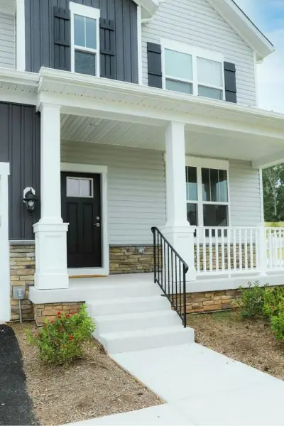 small white porch with white railings