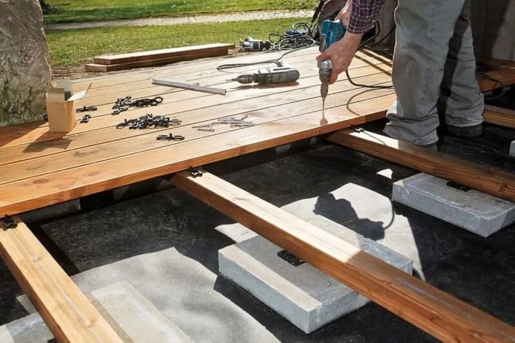 a deck contractor installing wooden deck